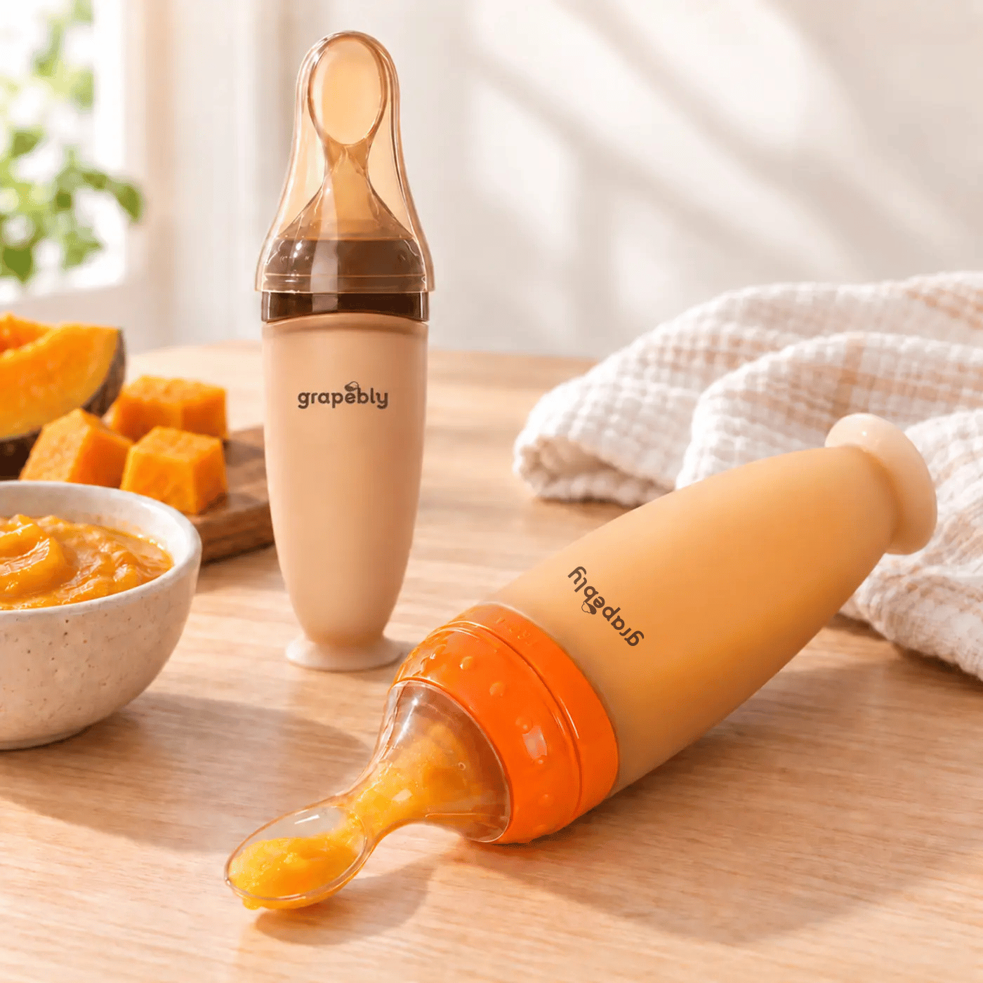 Grapebly 120ml silicone baby food feeder with spoon in orange and coffee colours